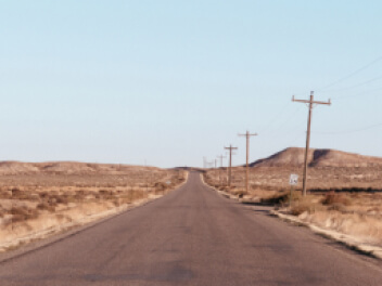 Long empty desert road