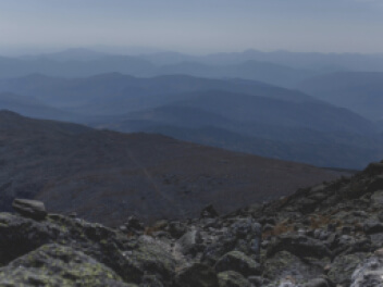 Looking down from a rocky mountainside